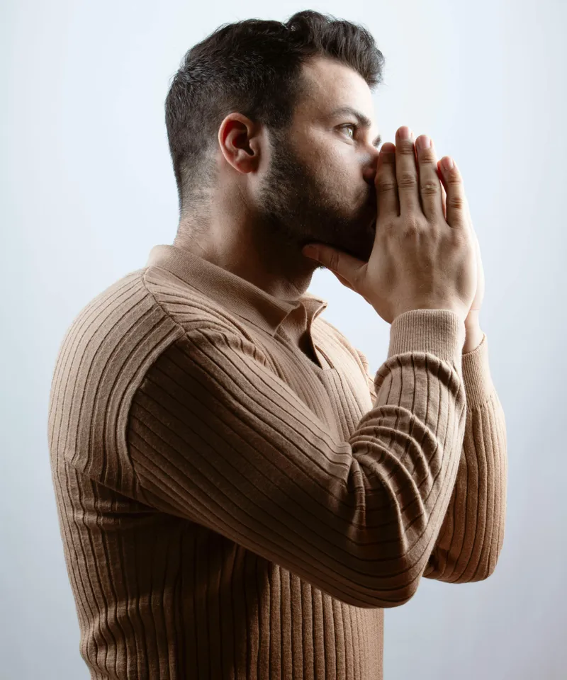 Bearded man in deep contemplation, representing focused cognitive performance